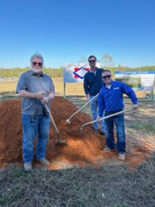 Team members breaking ground with shovels at the Bailey Creek Health and Rehab new facility site.