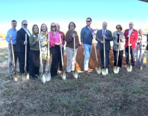 Bailey Creek Health and Rehab staff and leadership posing with shovels at the facility groundbreaking ceremony.