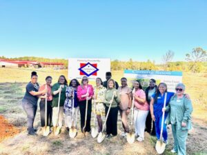Community members and Bailey Creek representatives participating in the new facility groundbreaking.